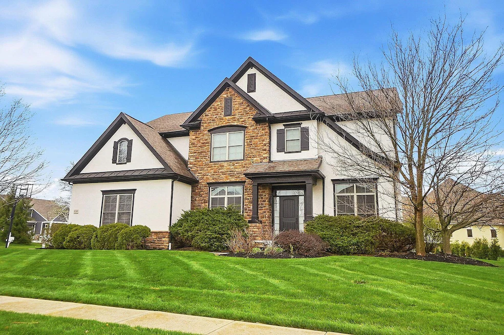 Stone and stucco luxury home at 8149 Grant Dr, Dublin, Ohio